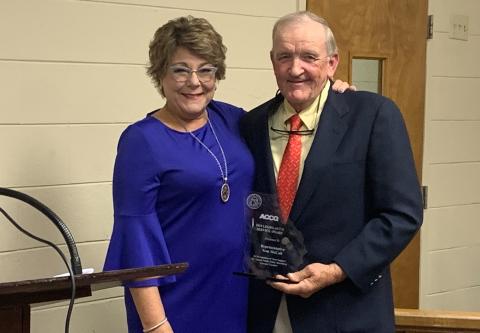 Representative Tom McCall received the 2019 Legislative Service Award from Debra Nesbit from the ACCG at the BOC meeting Oct. 16 (Photo by Scoggins). 