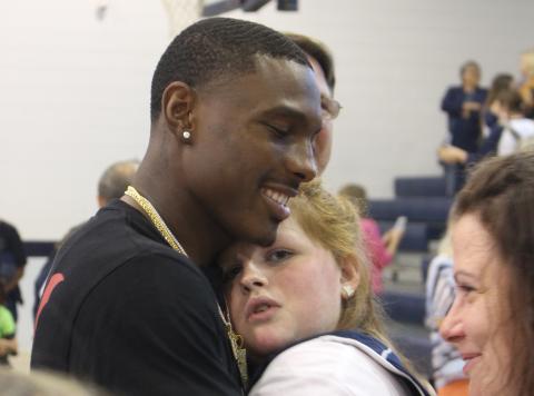 Kansas City Chiefs wide receiver Mecole Hardman surprised everyone by showing up at Elbert County Middle School Friday after a Thursday night NFL game in Denver. Among the many who got to greet Mecole was Marti Love Terrell.  Hardman also participated in a Friends Helping Friends basketball game. (Photo by Scoggins)