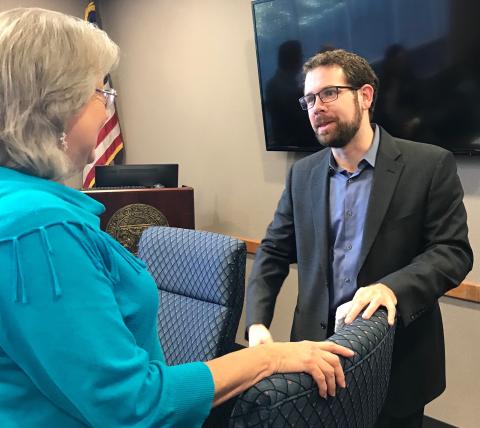 Daniel Dobbins (right), hired unanimously by the development authority Thursday, talks with authority member Leona Brown. (Photos by Jones)