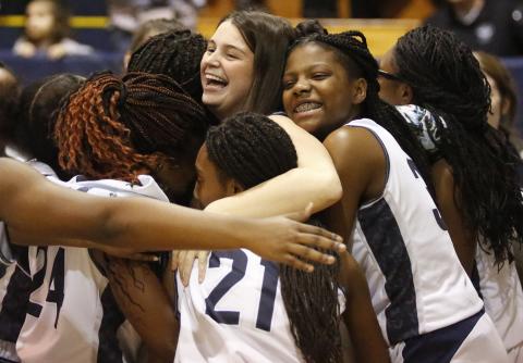 Lady Blue Devil teammates hug injured senior Maggie Campbell (center) at the conclusion of Senior Night Jan. 31 in the Inferno. (Photo by Cary Best)