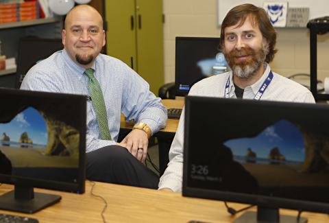 ECCHS Principal Jason Kouns chats with ECCHS teacher Nat McCarty. (Photo by Best)