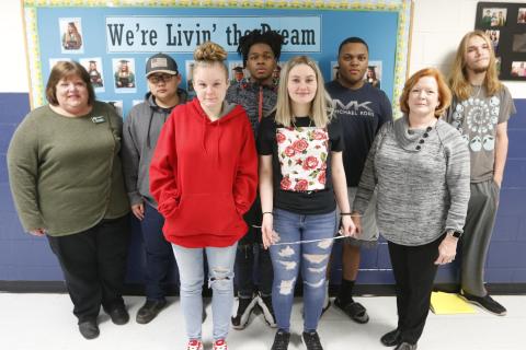 Mountain Education Center offers ‘a lot more support here;’ Shown are (L-R) Mountain Ed Administrator Laura Lynch, Emmanuel Kim, Faith Carey, Miles Plummer, Emma Smith, Brandon Heard, Mountain Ed Administrator Renee Padgett and Seth Adams. (Photo by Scoggins)