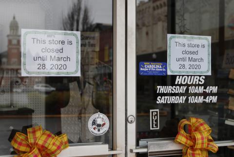 C&M Thrift Store posted signs on their doors to let customers know they would be closed until March 28. (Photo by Scoggins)