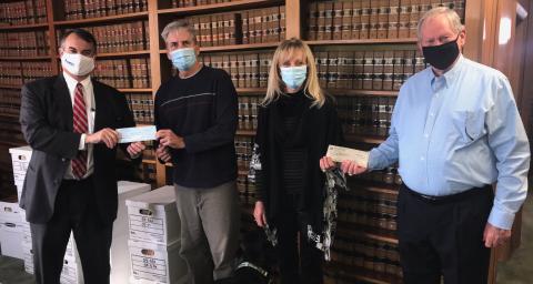 Georgia House District 33 Representative Rob Leverett (left) and Jerry Spivey (right) made a donation to Friends Helping Friends last week, using funds they would have normally spent for an annual buffet that was canceled due to COVID-19. Shown accepting donation are Jeff and Sandy Adams. (Photo by Jones)