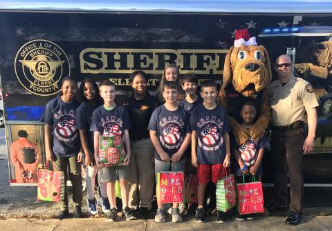 Elbert County Sheriff’s Office Lt. Marc Fleming, shown at the far right prior to a Christmas parade in Elberton, said his work as a school resource officer was the “best way to make a difference in the community.’ That ended Wednesday when the 14-year law enforcement veteran received a one-day notice by certified mail that Sheriff Melvin Andrews was firing him.