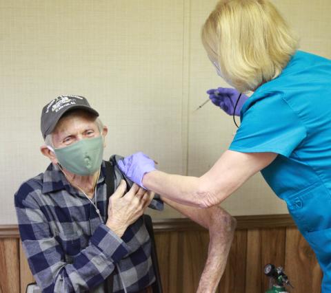 Billy Scoggins of Dewy Rose received the Pfizer COVID-19 vaccine from The Medical Center’s Tina Mewborn at The Medical Center’s COVID-19 vaccine facility Jan. 13. The Medical Center announced Jan. 4 they were accepting appointments for established patients ages 65 and older by calling 706-283-3315. (Photo by Scoggins)