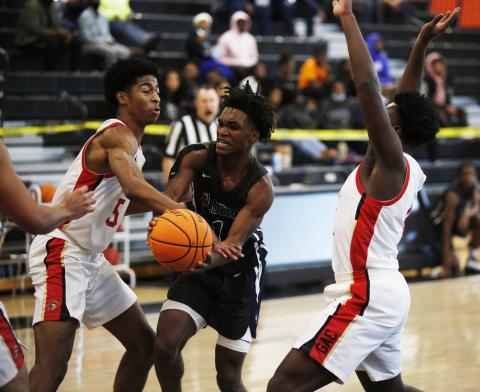 Jaelin Webb attempts to make a pass in heavy traffic in the McDonald’s Shootout Tournament at Hart County High School in Hartwell Monday. (Photo by Scoggins)
