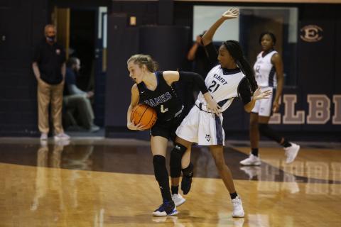 Sophomore Niya Moon attempts to block the Lady Leopards’ defense Jan. 22 in the Inferno (Photo by Scoggins) 