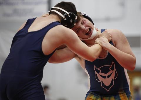 Josiah Harkins grapples with his opponent from Glenn Hills Jan. 15 during the 5AA Area Duals at Oglethorpe County High School in Lexington. (Photo by Scoggins)