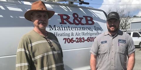 Following in the footsteps ... Cole Ferrell (right) started working with his father as soon as he could drive an R&B Maintenance truck. (Photo by Jones)