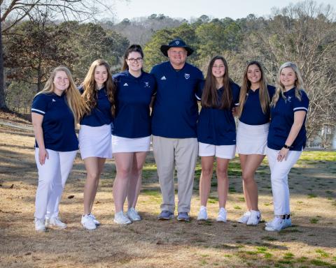 Lady Devil golfers include (L-R) Emma Grace Jarvis, Elizabeth Brady, Ava Dye, Coach Bruce Brown, Abby Bryant, Madison Webb and Emaleigh Oglesby.  