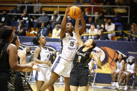 Lady Devil Jameria Allen watches as Jordan Glaze attempts to put up a shot against the Temple Lady Tigers during the first round of the GHSA state playoffs in the Inferno Tuesday, Feb. 23. By defeating the Lady Tigers 52-14, the Lady Devils advanced to the Sweet Sixteen, where they defeated South Atlanta 62-28 Friday, Feb. 26. (Photo by Scoggins)