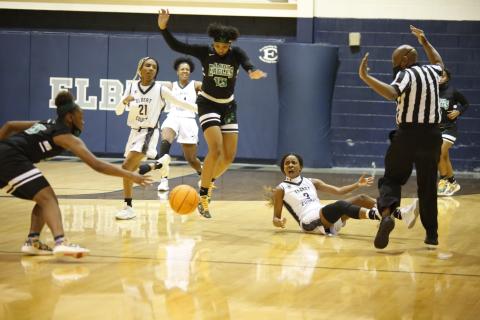 Niya Moon (21), Jamia Allen and Aaniyah Allen (3) react after Aaniyah was knocked to the ground by a referee during Tuesday’s 46-45 loss against Josey in the playoffs. (Photo by Scoggins)