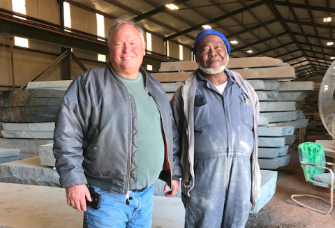 Mark Hill stands with Hillcrest Granite’s first employee, Clark Rucker, who was hired by the fledgling granite company back in 1979, when Mark and his father, Calvin, started the business. (Photo by Jones)