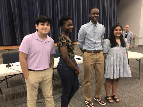 REACH award winners at Monday’s BOE meeting are (L-R): Angel Castillo, Myiah Davis, Korbin Eberhardt and Melanie Guerreo Blanco. Kimberly Segura, another award winner, is not pictured. (Photo by Jones)