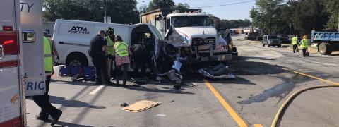College Avenue, the main artery through Elberton on the west side of town, was closed to all traffic during most of the morning on Wednesday, June 16. Authorities still aren’t sure why the reinforced “ATM Response” van on the left crossed from the eastbound lanes of College Avenue turning lane,  through the turning lane and into the westbound side. Three men  were transported to hospitals after the accident. (Photo by Jones)