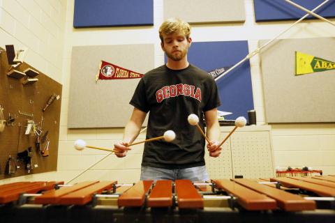 Salutatorian Ethan Cone plays the marimba in the band room at Elbert County Comprehensive High School. Cone said music and band have been his favorite part of high school. (Photo by Scoggins) 