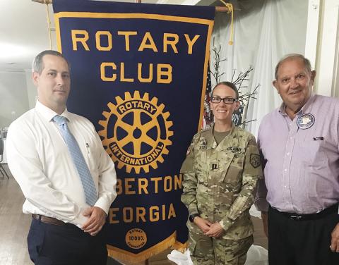 Capt. Bates (center) recently spoke at the Rotary Club of Elberton. Rotary President Chris Dyal is on the left and Rotarian and former National Guard General Joel Seymour is on the right (Photo by Jones)