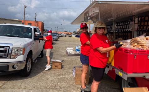 Local Salvation Army volunteers (L-R) Ann Hendrix, Pam Brown and PJo Phelps serve meals in New Orleans.