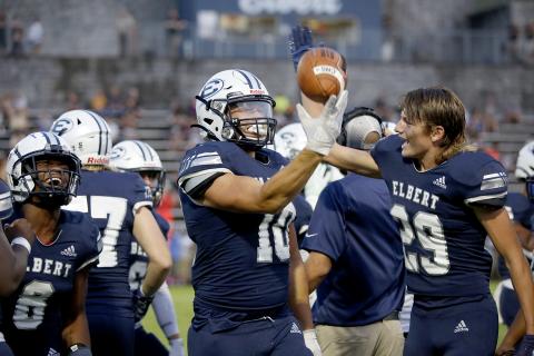Fuquan Hargrove (No. 8) and brothers Bryce Dickerson (No. 10) and Brady Dickerson (No. 29) celebrate Bryce’s fumble recovery that led to the Blue Devils’ first score of Friday’s 27-14 victory over Commerce in the Granite Bowl. (Photo by Scoggins)