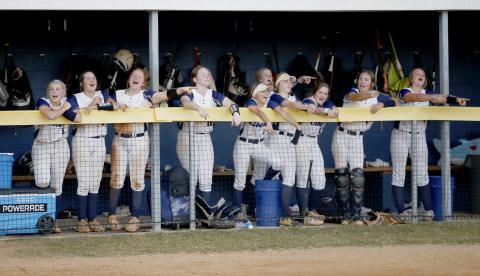 Lady Devils Chesnee Brown, Dallas Dean, Ava Lunsford, Lilly Ray, Gracie Brady, Jayda Wood, Miller Drake, Emalise Andrews, Reagan Baker and Katelyn Edwards lead a softball chant from the dugout during the Lady Devils’ 12-0 and 19-0 wins against Washington High School in the first round of the GHSA State Playoffs Tuesday, Oct. 12. (Photo by Scoggins) 