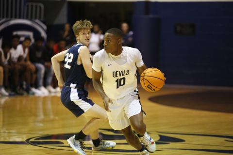 Senior Jamil Burton, pictured above during Thursday’s scrimmage against West Oak, will lead the Blue Devils this year. The Devils, along with Coach Don Hurlburt, are looking to defend the region championship title the team took home last season. (Photo by Scoggins)