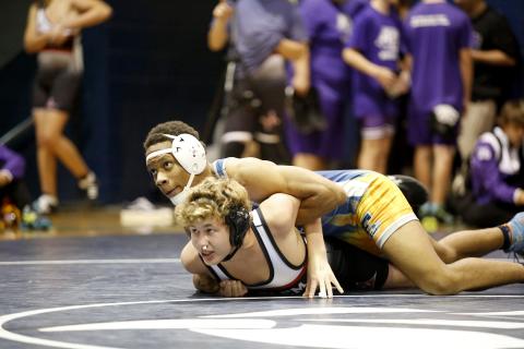 Zion Cullars works to pin his Harlem opponent Nov. 30. The Mat Devils are scheduled to host 12 teams during the Inferno Invitational Saturday, Dec. 11 at 9 a.m. (Photo by Scoggins)