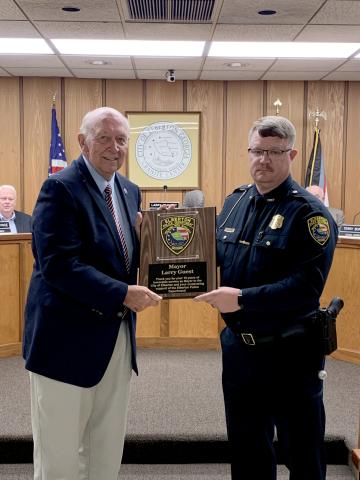 Elberton Police Chief Scott Marunich  (right) recognized Mayor Larry Guest (left) for his 16 years of service as mayor of Elberton during Monday night’s meeting. Guest’s last meeting as mayor will be the Jan. 3 meeting. (Photo by Scoggins) 