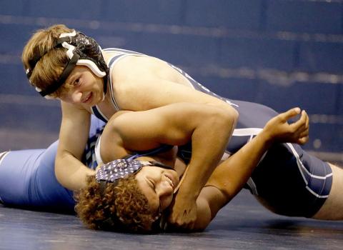 Josiah Harkins makes a half nelson pin during the JV Inferno at the Inferno Tuesday, Nov. 23. Harkins finished in second place for the day at 152 pounds. (Photo by Scoggins) 