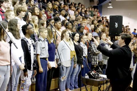 The Elbert County Chorus program, led by Director Allyson Dye and pictured above during the annual Veterans Day program at ECCHS, is raising funds to perform at the Pearl Harbor commemoration in Hawaii next year. (Photo by Scoggins)