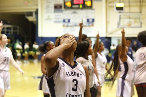 Junior Lady Devil Aaniyah Allen blows a kiss to the scoreboard while the rest of the Lady Devils show off the score to the crowd of Josey Eagle fans after the Lady Devil’s 48-45 win over Josey High School Saturday, Dec. 4 in the Inferno. The match up between the two teams was a big rematch for the Lady Devils, who fell to the reigning state champion Lady Eagles 46-45 in last season’s Elite Eight game in the Inferno. (Photo by Scoggins) 