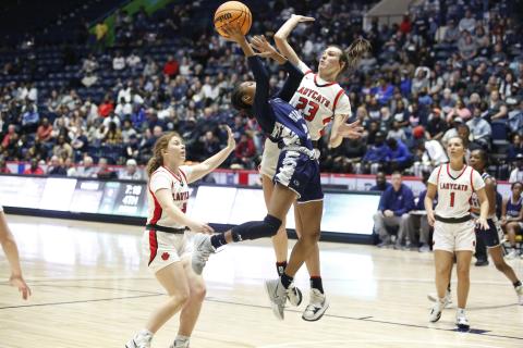 Lady Devil Niya Moon attempts to attack the basket but is blocked and knocked down by a Rabun County defender during the GHSA state championship game in Macon Thursday, March 10. (Photo by Scoggins)