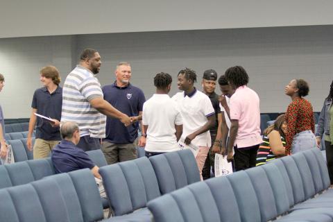 Coach Ed Geth (left) was introduced to members of the Devils basketball team Monday, April 25 during the team’s end-of-the-year banquet. Although not officially hired, the committee to hire a new Devils head basketball coach will recommend the BOE hire Geth at the May 9 work session. (Photo by Wells) 
