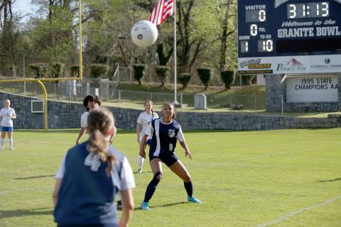 Jade Partain (No. 4) makes a throw in towards Hannah Halavin during the Lady Devils win over Banks County. (Photo by Wells)