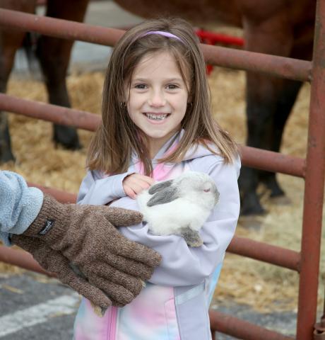 Due to the rainy weather, the Elbert County Chamber of Commerce and Main Street Elberton’s Easter egg hunt, featuring the Easter bunny, was canceled Saturday, April 13. However, another bunny made an appearance during the cold Spring Festival Saturday, April 9. Pictured holding a bunny from Elbert County Farm Bureau during the festival is six-year-old Josie Butler. 