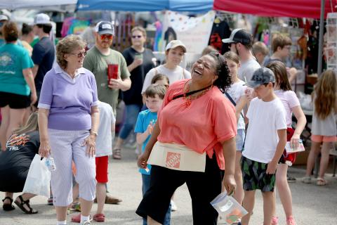 After several attempts to pull a winning number, Linda Allen laughs as a cakewalker pulls his own number to take the cake during the City of Bowman’s annual spring festival and Big Iron Crank Up Saturday, April 23. For more photos, see page 8. (Photo by Scoggins) 