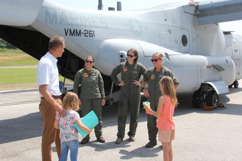Mayor Daniel Graves, along with daughters Auri and Zola, met the crew of one of the Marine Corps MV-22 Ospreys that landed at the Elbert County Airport last week. (Photo by Wells) 