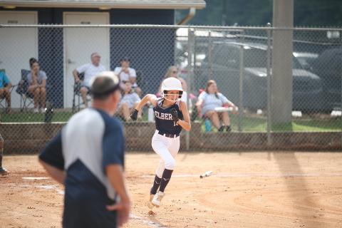 Peyton Jenkins makes her way to first base during the Lady Rams’ exhibition game against Washington-Wilkes Saturday, July 30.
