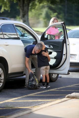 Students across the Elbert County School District returned to school Monday, Aug. 2. Among them were students at Elbert County Primary School, who received hugs and kisses from parents before beginning the school day. See more photos of the school’s first day of school on page 6. (Photos by Scoggins)