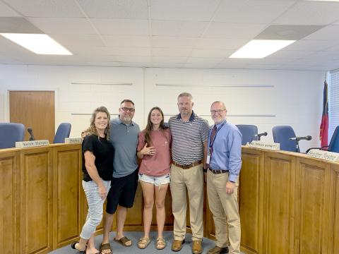 Pictured during the meeting are (L-R) parents Jessica and Travis Bryant, Bryant, Coach Larry Kesler and Superintendent Jon Jarvis. (Photo by Wells) 