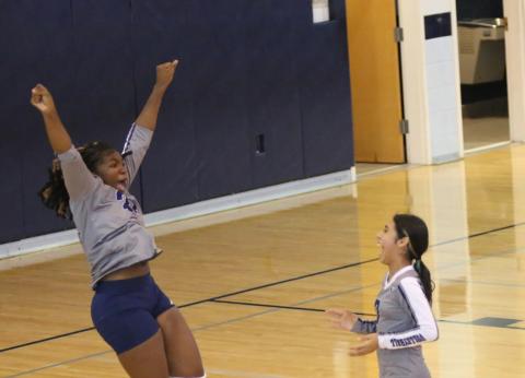 Jurnee Porter jumps for joy as Sophia Vargas laughs at Porter’s reaction during the Lady Rams’ win over Stephens County Middle School Aug. 31. (Photo by Wells)