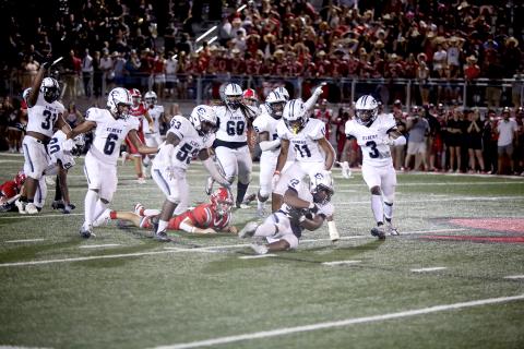 A host of Blue Devils celebrate as Gilbert Fortson (No. 42) recovers a fumbled ball from Madison County’s Red Raiders during the Devils’ 48-34 win over the county-line rivals Friday, Aug. 26 in Danielsville. After Friday’s game, the Devils top the state charts at No. 11 for Class A Division 1, according to MaxPreps. The Devils return home Friday, Sept. 2 to host Harlem for their third game of the season. (Photo by Scoggins) 