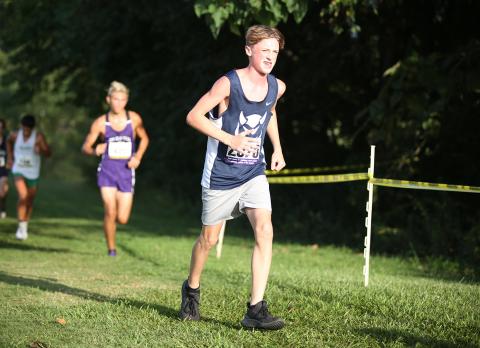 Devil runner freshman Ezra Adamson (left) is listed as No. 13 in the region for male runners. (Photo by Scoggins)