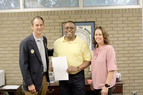 The City of Elberton and the Elbert County Board of Commissioners recently signed proclamations for the Elbert County Chamber of Commerce’s celebration of “National Support your Local Chamber of Commerce” day. Pictured with the proclamations are (L-R) Mayor Daniel Graves, Chamber Chairman Kam McClary and Executive Director/President Rebecca Holliday (Photo by Wells)