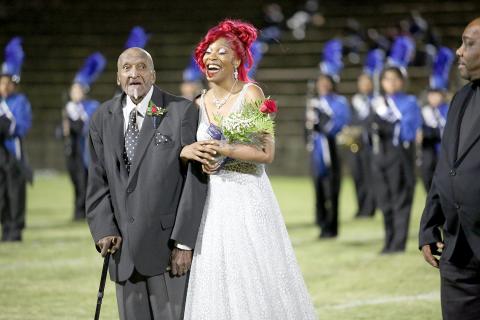 Elbert County Comprehensive High School senior Jamia Allen (right) was named the 2022 Homecoming Queen during Thursday’s homecoming game. Allen, a member of the 2021-2022 AA State Champion basketball team, was escorted by her grandfather James Zanders. See more photos from the homecoming football game and parade on pages 8, 9 and 11. (Photo by Scoggins) 