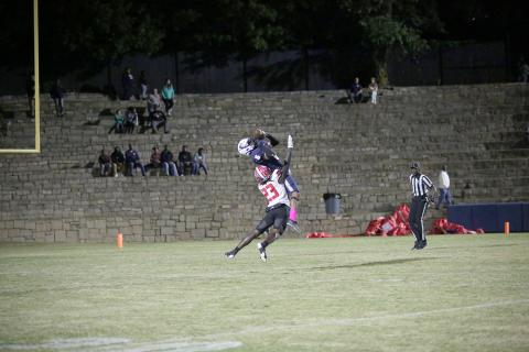 Senior Trustin Allen is rammed by a Rabun County Wildcat as he attempts to catch a pass during the Devils’ first loss of the season in the Granite Bowl Friday, Oct. 14. (Photo by Wells)