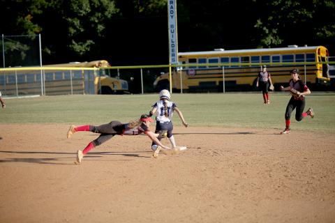 Hannah Brady safely slides past a Rabun County Lady Cat during the Devils’ 5-0 region win Oct. 4. The Lady Devils went on to secure the region championship after falling 4-0 to Commerce Oct. 6. (Photo by Wells) 