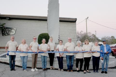 Pictured during the ribbon cutting are (L-R) KECB Board of Directors Jeff Amich, Donna Dixon, Gerry Besherat, Rita Harper, Elizabeth Tyler, Pam Allgood, Wayne Childs, Elaine Fortson, Michelle Amich, Patti McLanahan, and Jimmy White. Board members not pictured are Bill Hood and Kevin Lewis. (Photo by Scoggins)