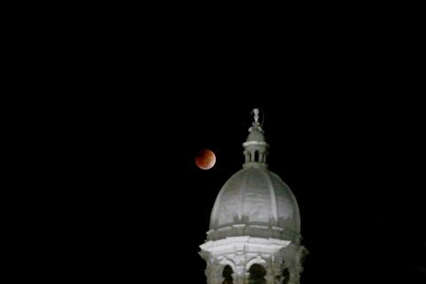 A total lunar eclipse took place between 5:16 a.m. and 6:41 a.m. over the East Coast of the United States Tuesday morning as the moon passed entirely into the Earth’s shadow. The beginning of the red eclipse could be seen just beyond the Historic Courthouse. According to NASA’s website, the next total lunar eclipse won’t take place again until March of 2025. (Photo by Scoggins)