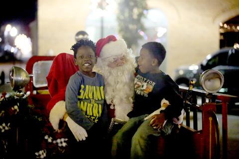Main Street Elberton’s Candlelight Shop Night drew large crowds on the downtown square Tuesday, Nov. 22, including a visit from Santa Claus. Local merchants and small businesses opened their doors and booths, the County-Line Jazz Band performed with lighted instruments and the lighting of the city’s Christmas tree was officially held. (Photos by Scoggins)